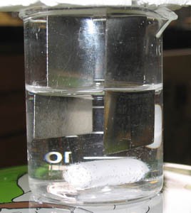 Two nickel electrodes in a beaker of clear liquid