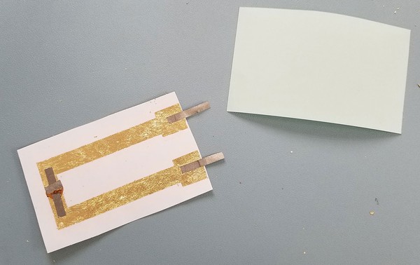 Checking the temporary tattoo adhesive film size. 