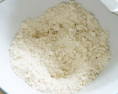Vegetable shortening and flour are mixed in a large bowl