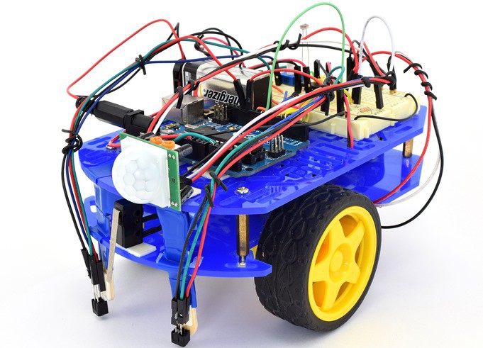 Bluebot robot chassis with a breadboard circuit and Arduino Uno mounted on top.   