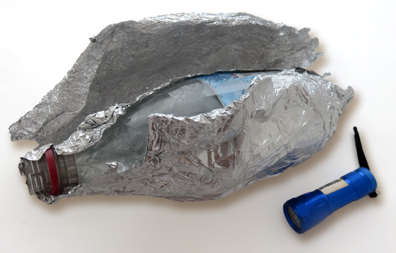 Plastic bottle covered in aluminum foil for a light science activity