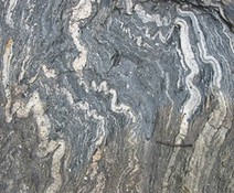 metamorphic rock with warped, squiggly layers