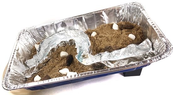 Side view of the inclined aluminum pan which includes the river model.