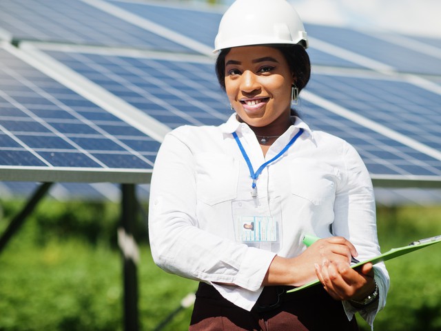 engineer by solar panels