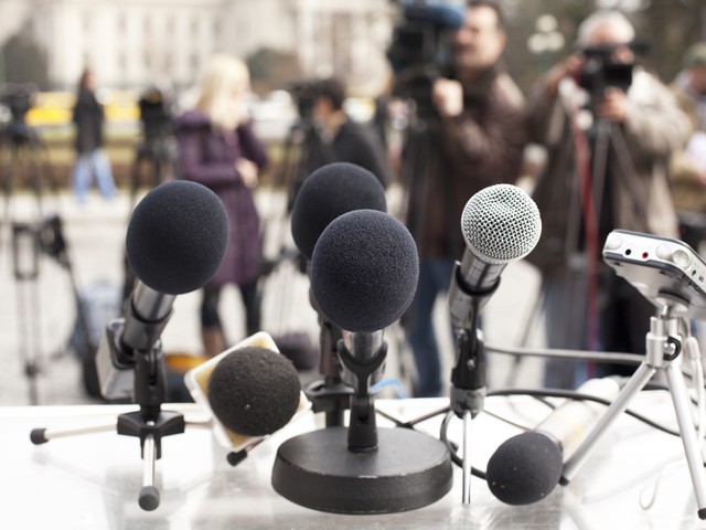 microphones set up for a press conference