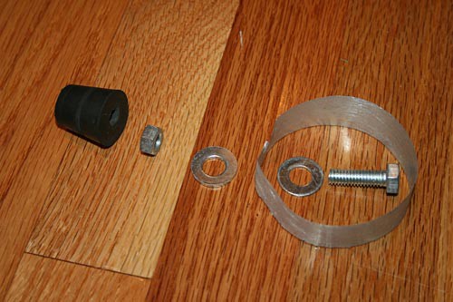 An aluminum ring, nut, bolt, rubber stopper and two washers