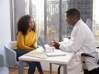 male doctor having serious consultation with patient