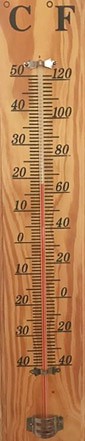 A liquid thermometer mounted to a wooden board with markings for Fahrenheit and Celsius