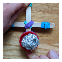 Popsicle stick catapult with aluminum foil ball - Awesome Summer Science Experiments