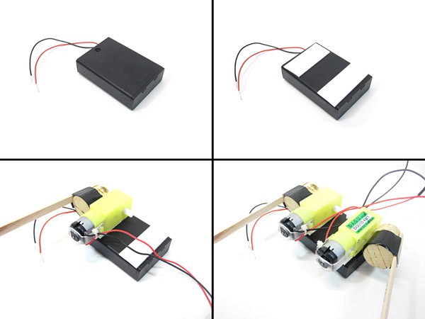Two DC motors each with a cork and popsicle stick attached are taped to the same side of a battery pack