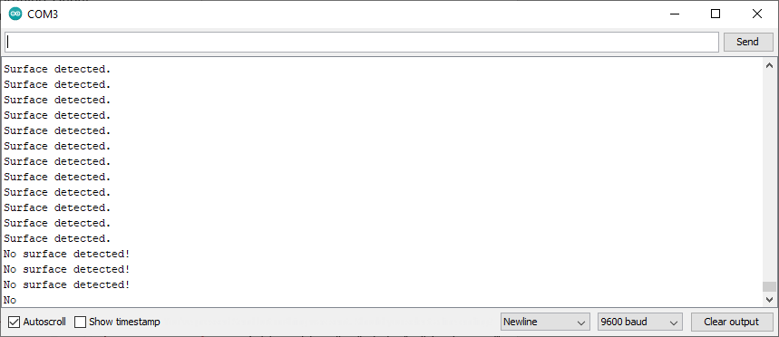  Arduino serial monitor displaying 'Surface detected.' And 'No surface detected!' text. 