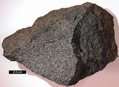 jagged igneous rock with grainy, sparkly appearance, no visible layers