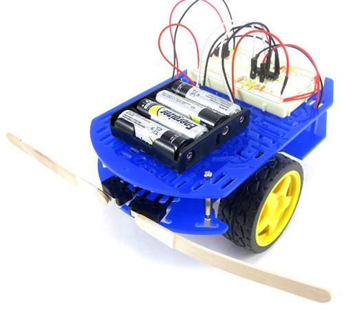 Photo of a robot designed to avoid obstacles using popsicle stick bumpers