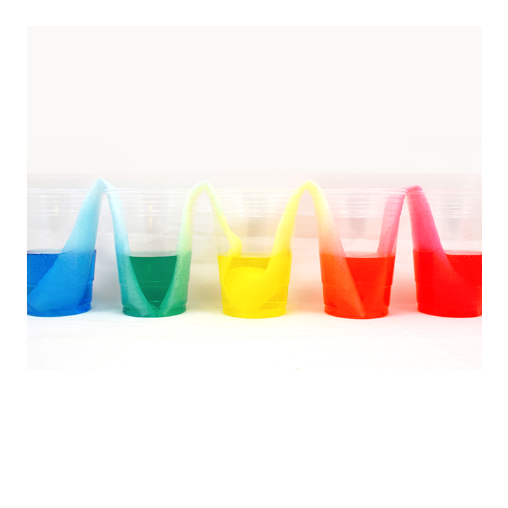 Walking water experiment with cups of colorful water connected by paper towels - Awesome Summer Science Experiments