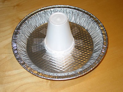 Styrofoam cup attached to a aluminum pan with tape