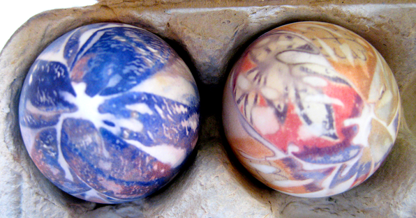 Two eggs that have been dyed using silk ties