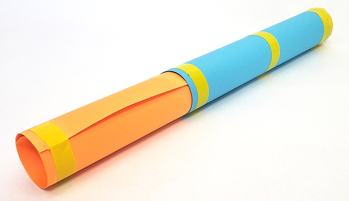 A second piece of cardstock rolled up and inserted into the first piece of cardstock.