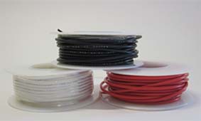 Three spools of red, black and white hookup wire