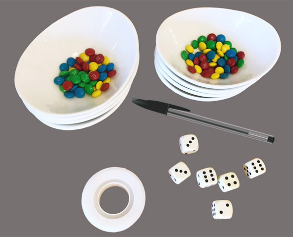 Materials needed for the autoimmune activity which include six six-sided dice and m&m candies