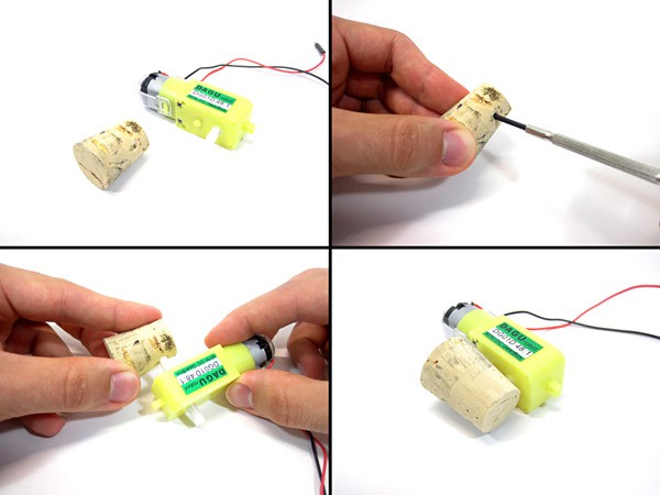 The side of a cork is pierced and attached to the shaft of a DC motor