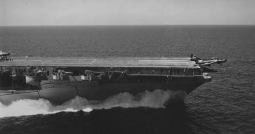 A jet takes off from the deck of the U.S.S Intrepid