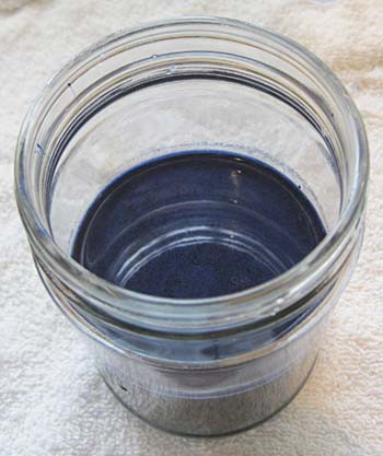 Blue dye in a glass jar