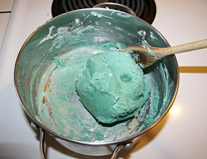 A green clay ball in a pot