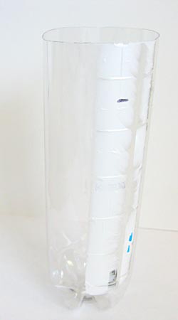 A fill line is marked on the outside of a cut plastic bottle