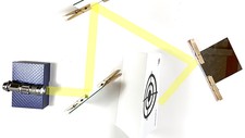 A mirror maze with mirrors, a flashlight, and paper