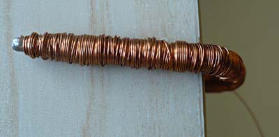 An iron core wrapped in copper wire is bent into a U shape