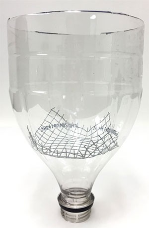 Wire mesh is inserted into the neck of a soda bottle that has been cut in half