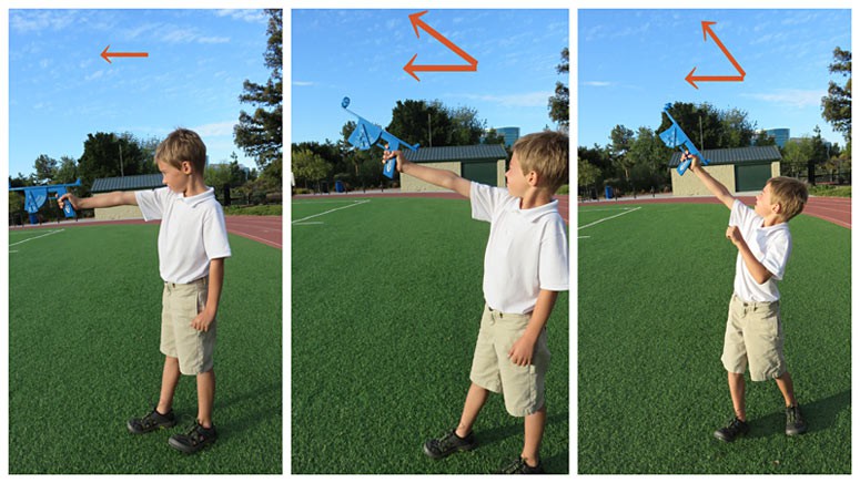 A boy uses an altitude finder to measure the height a model rocket travels