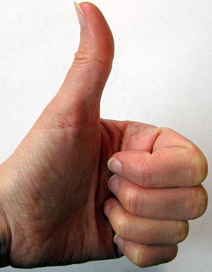 A hand making a thumbs up signal