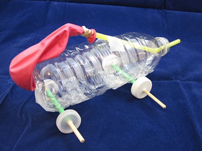 A balloon powered car made from plastic straws, a plastic bottle and bottle caps