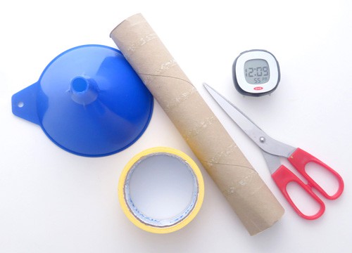 A plastic funnel, roll of tape, cardboard tube, scissors and a stopwatch