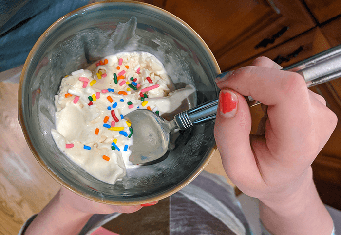 A bowl of homemade ice cream with colorful sprinkles