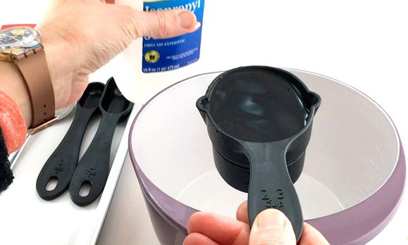 2/3 cups of isopropyl alcohol being added to a clear solution