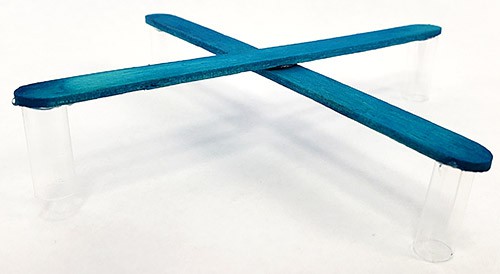Popsicle stick frame with four straws as legs