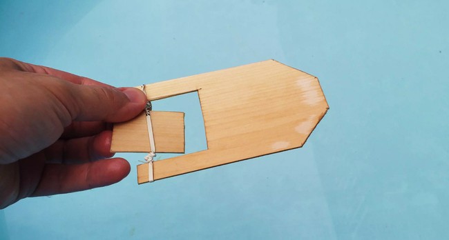 A rubber band paddle boat made from balsa wood.