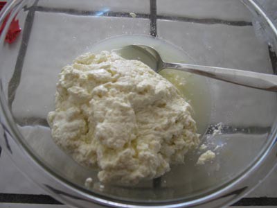 Milk curds are placed in glass bowl