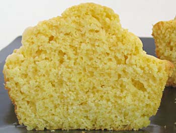 Photo of the inside of a corn muffin that has been cut open