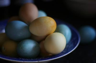 Dyed eggs stacked on a plate