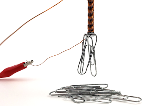 Large bolt that is part of an electromagnetic circuit and has paperclips attached