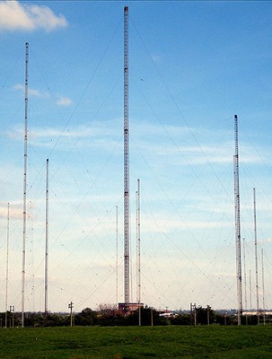  radio towers, tall skinny towers supported by guy wires that are tied to the ground 