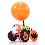 Balloon car with a halloween and batmobile theme made from a balloon, recycled cardboard tube, and craft materials