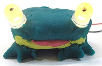 Model clay frog has two LEDs for eyes