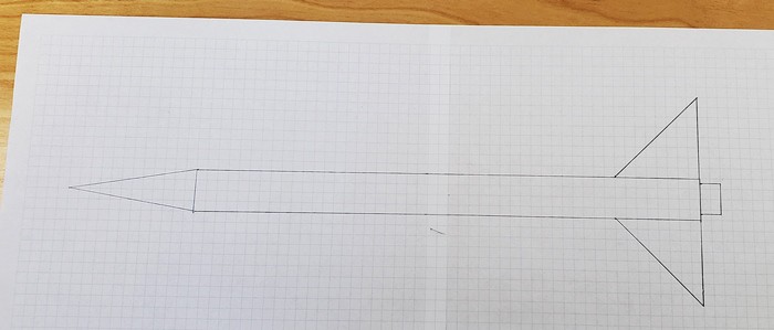 2D drawing of rocket on graph paper