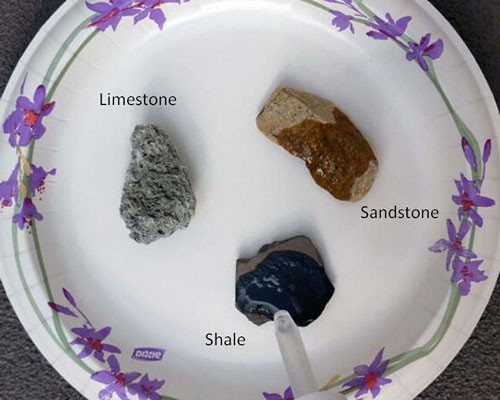Three drops of oil are placed on three different rocks
