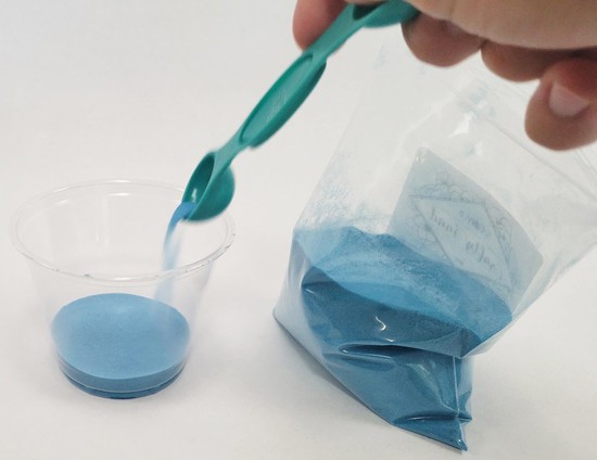  A second thin layer of sand covering the glue 