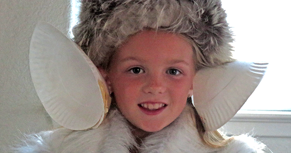 Student with two homemade hearing devices made from paper plates